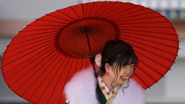 A participant poses for a photo following a Coming of Age ceremony at Toshimaen amusement park in Tokyo. Ceremonies on this national holiday are held at city halls and large centres in smaller towns while bigger cities like Tokyo have multiple ceremonies spread out. (Shizuo Kambayashi / AP) A participant poses for a photo following a Coming of Age ceremony at Toshimaen amusement park in Tokyo. Ceremonies on this national holiday are held at city halls and large centres in smaller towns while bigger cities like Tokyo have multiple ceremonies spread out. (Shizuo Kambayashi / AP)