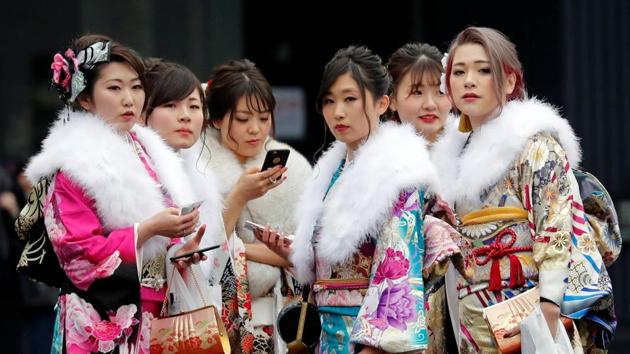Japanese women attend their Coming of Age Day celebration ceremony at an amusement park in Tokyo, Japan on January 8, 2018. Dazzling in colourful kimonos and wafting clouds of hairspray in their wake, thousands of young Japanese women marked their entry into official adulthood. (Kim Kyung-Hoon / REUTERS) Japanese women attend their Coming of Age Day celebration ceremony at an amusement park in Tokyo, Japan on January 8, 2018. Dazzling in colourful kimonos and wafting clouds of hairspray in their wake, thousands of young Japanese women marked their entry into official adulthood. (Kim Kyung-Hoon / REUTERS)