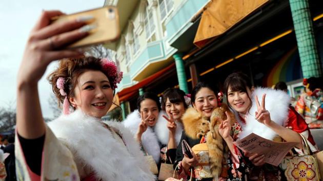 Revellers pose in kimonos as they attend their Coming of Age Day celebrations. The ceremonies eventually lead into more informal celebrations with photoshoots, heading out with friends to restaurants, amusement parks and bars for legal drinking. (Kim Kyung-Hoon / REUTERS) Revellers pose in kimonos as they attend their Coming of Age Day celebrations. The ceremonies eventually lead into more informal celebrations with photoshoots, heading out with friends to restaurants, amusement parks and bars for legal drinking. (Kim Kyung-Hoon / REUTERS)