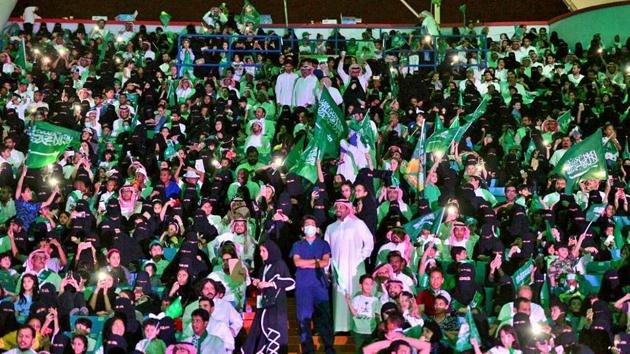 In this Sept. 23, 2017 file photo released by Saudi Press Agency, SPA, Saudi men and women attend national day ceremonies at the King Fahd stadium in Riyadh, Saudi Arabia. (AP File Photo)