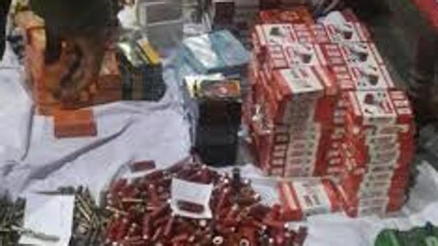 The police recovered 25 rifles, one machine gun, 19 revolvers and 4,166 live cartridges from a stolen Bolerao