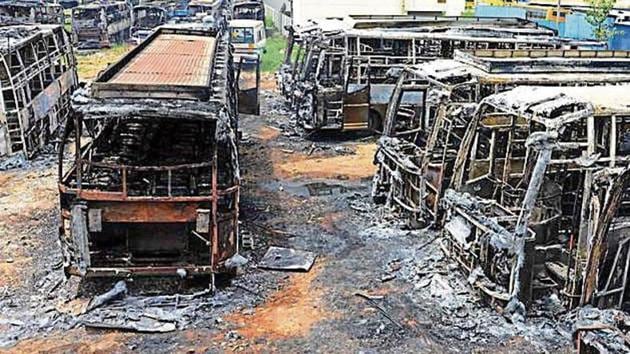 Buses burnt by protesters in Bengaluru during violence on the Cauvery river water issue. (Kashif Masood / HT File Photo)