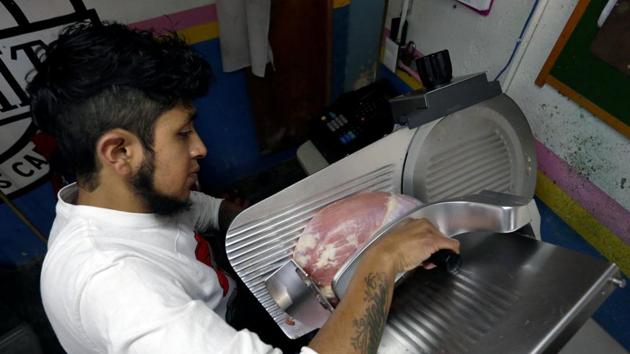 A butcher cuts beef at a market stall. (Reuters file) A butcher cuts beef at a market stall. (Reuters file)