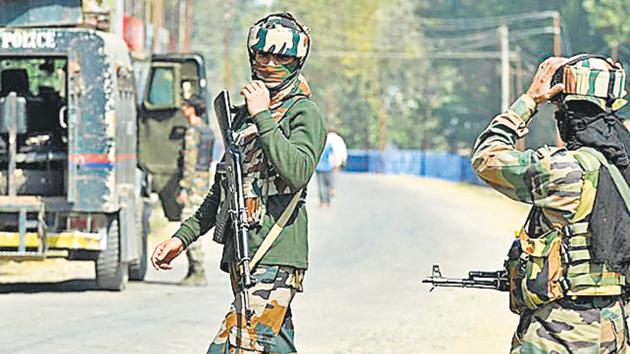 Security forces stand guard at village in restive Kashmir valley. (AFP File Photo) Security forces stand guard at village in restive Kashmir valley. (AFP File Photo)