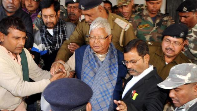 RJD chief Lalu Prasad flanked by security personnel on his way to appear in a special CBI court in Ranchi. (HT File Photo) RJD chief Lalu Prasad flanked by security personnel on his way to appear in a special CBI court in Ranchi. (HT File Photo)