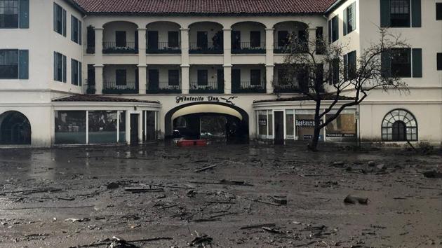 The Montecito Inn sits in flooded waters and debris after the disaster. The threat of mudslides had prompted the county to order 7,000 residents to leave their homes ahead of a powerful rainstorm and to urge 23,000 others to evacuate voluntarily. (Kenneth Song / Santa Barbara News-Press / REUTERS) 