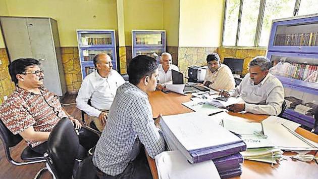 People deposit their property tax at an income tax office in Gurgaon. (File) People deposit their property tax at an income tax office in Gurgaon. (File)