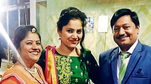Sanhita, flanked by Geeta and her new father.(HT)