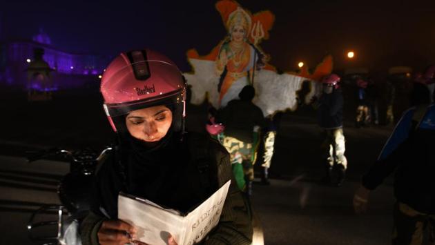 A cadet looks through a register during their early morning rehearsals for the Republic Day parade on Rajpath. Named ‘Seema Bhavani’,  members of this special biker squad have been specially chosen by BSF trainers and are aged between 25-30 years.  (Vipin Kumar / HT Photo) 