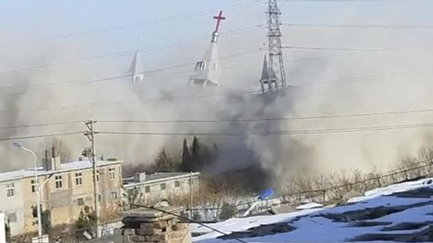 In this image taken from video shot Tuesday, Jan. 9, 2018, by China Aid and provided to the Associated Press, clouds of debris billow during the demolition of the Golden Lampstand Church in Linfen in northern China's Shanxi province.(AP)