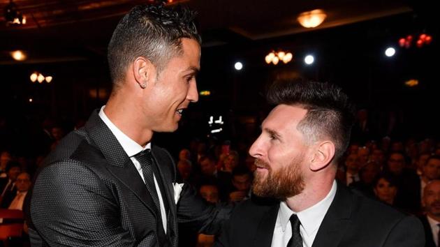 Cristiano Ronaldo (L) and Lionel Messi are both part of the UEFA Fans’ Team of the Year.(AFP)