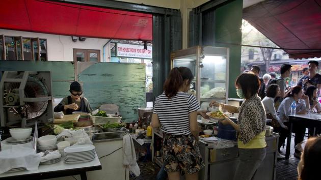 Since receiving the accolade, her once relatively quiet restaurant has been busier than ever. She now opens shop from 3 pm to 2 am, but people start queueing up well before that. By afternoon on most days, a “full house” sign is hung up, indicating that no further customers can be accommodated. (Gemunu Amarasinghe / AP)