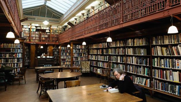 A library member reads in the New Room inside the library. Libraries of this kind were a feature of many towns of UK in the late 18th and early 19th centuries. (Ian Forsyth / Getty Images)
