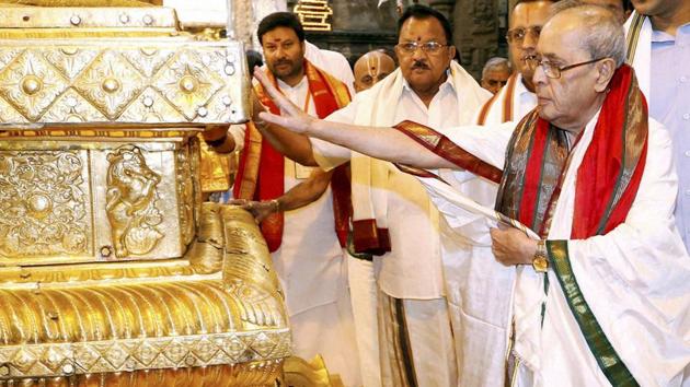 Former President Pranab Mukherjee is seen offering prayer at golden sanctum sanctorums of Lord Venkateswara temple at Tirumala in Tirupati. (PTI File Photo) Former President Pranab Mukherjee is seen offering prayer at golden sanctum sanctorums of Lord Venkateswara temple at Tirumala in Tirupati. (PTI File Photo)