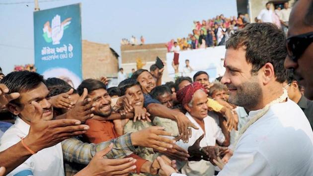 Congress president Rahul Gandhi meeting supporters at a roadshow in Mehsana district during Gujarat election campaign.(PTI Photo)