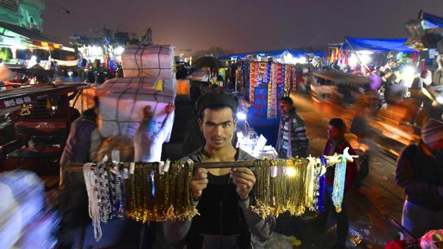 Every morning Tiwari leaves his Paharganj house to help his father sell trinkets in the crowded lanes of Sadar Bazar. His father Ramesh has been selling hair clips on pavements for the last six years. (Raj K Raj / HT Photo) Every morning Tiwari leaves his Paharganj house to help his father sell trinkets in the crowded lanes of Sadar Bazar. His father Ramesh has been selling hair clips on pavements for the last six years. (Raj K Raj / HT Photo)