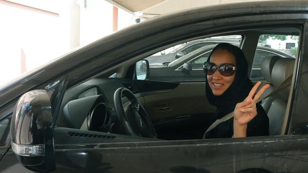Saudi activist Manal Al Sharif, who now lives in Dubai, flashes the sign for victory as she drives her car in the Gulf Emirate city on October 22, 2013. (AFP file) Saudi activist Manal Al Sharif, who now lives in Dubai, flashes the sign for victory as she drives her car in the Gulf Emirate city on October 22, 2013. (AFP file)