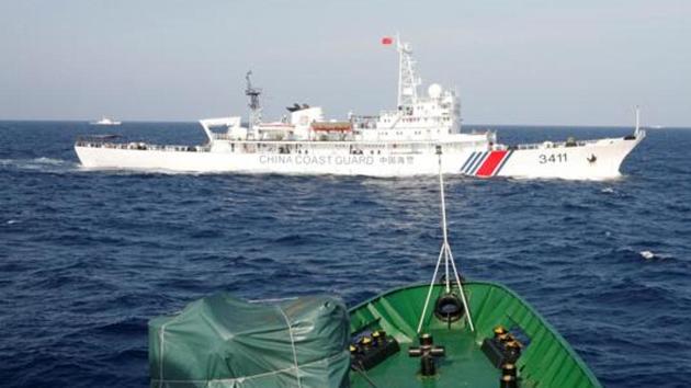 A file photo of a ship of the Chinese Coast Guard seen near a ship of the Vietnam Marine Guard in the South China Sea, off shore of Vietnam. (REUTERS) A file photo of a ship of the Chinese Coast Guard seen near a ship of the Vietnam Marine Guard in the South China Sea, off shore of Vietnam. (REUTERS)