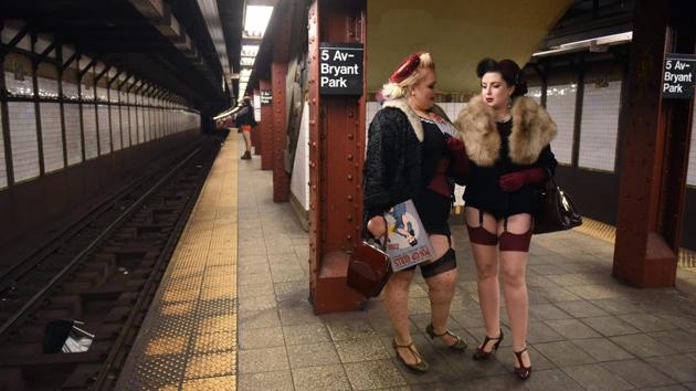 Participants in the 17th Annual "No Pants Subway Ride" wait for a New York City subway train on January 7, 2018 in New York City. (Timothy A. Clary / AFP) Participants in the 17th Annual "No Pants Subway Ride" wait for a New York City subway train on January 7, 2018 in New York City. (Timothy A. Clary / AFP)