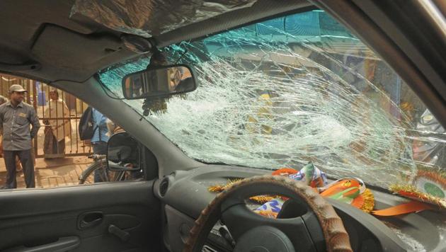A damaged car(WB 02 U 5521) of TMC supporters in front of Binani Bhawan due to clash between Bharatiya Janata Party and Trinamool Congress supporters on the issue of a rally at Pathuriyaghat street, North Kolkata in Kolkata, India, on Friday, January 12, 2018. (Samir Jana/HT PHOTO) A damaged car(WB 02 U 5521) of TMC supporters in front of Binani Bhawan due to clash between Bharatiya Janata Party and Trinamool Congress supporters on the issue of a rally at Pathuriyaghat street, North Kolkata in Kolkata, India, on Friday, January 12, 2018. (Samir Jana/HT PHOTO)