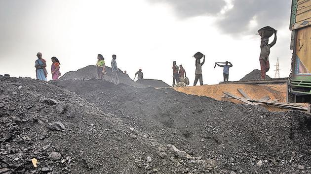 Labourers load a truck with coal at depot in Jaintia Hills, Meghalaya. In the state’s political field, all actors are privately conscious of the need to protect the environment, but they publicly want to be seen as favouring the economy.(Getty Images)