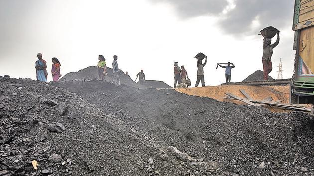 Labourers load a truck with coal at depot in Jaintia Hills, Meghalaya. In the state’s political field, all actors are privately conscious of the need to protect the environment, but they publicly want to be seen as favouring the economy.(Getty Images) Labourers load a truck with coal at depot in Jaintia Hills, Meghalaya. In the state’s political field, all actors are privately conscious of the need to protect the environment, but they publicly want to be seen as favouring the economy.(Getty Images)