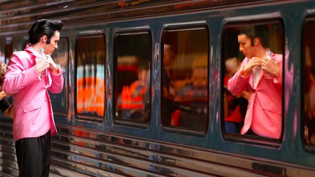Elvis Presley impersonator Brody Finlay looks at his reflection in the Elvis Express train at Sydney’s Central station on January 11, 2018. Last year’s event drew 25,000 people to Parkes, more than double the town’s population, and generated millions of dollars for the local economy. (Daniel Munoz / REUTERS) Elvis Presley impersonator Brody Finlay looks at his reflection in the Elvis Express train at Sydney’s Central station on January 11, 2018. Last year’s event drew 25,000 people to Parkes, more than double the town’s population, and generated millions of dollars for the local economy. (Daniel Munoz / REUTERS)