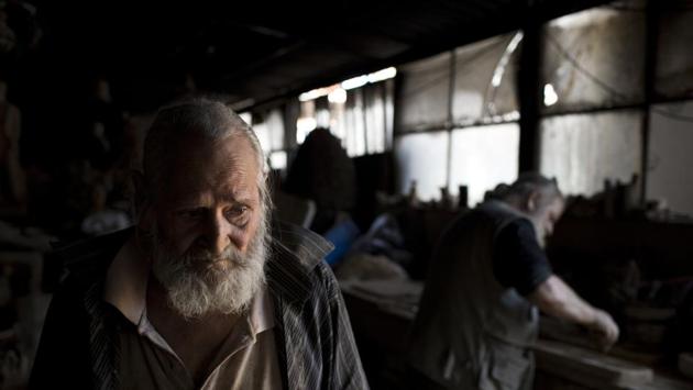 Pensioner Panayotis Goumas, 74, helps his brother Haralambos in his workshop. The tenth of 12 children, Haralambos was born next to the workshop — initially his father’s porcelain fittings business — then still surrounded by vineyards and orchards, with the Acropolis dominating the landscape. All his brothers worked here at some point, though he is the only one to have persevered. (Petros Giannakouris / AP)