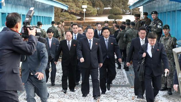 The North Korean delegation led by Ri Son Gwon, Chairman of the Committee for the Peaceful Reunification of the Country (CPRC) of DPRK, crosses the concrete border to attend a meeting at the truce village of Panmunjom in the demilitarised zone separating the two Koreas, on January 9, 2018. (Yonhap via REUTERS) The North Korean delegation led by Ri Son Gwon, Chairman of the Committee for the Peaceful Reunification of the Country (CPRC) of DPRK, crosses the concrete border to attend a meeting at the truce village of Panmunjom in the demilitarised zone separating the two Koreas, on January 9, 2018. (Yonhap via REUTERS)