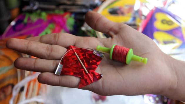 A miniature kite-and-manjha set at a shop in Jambali Naka, Thane. (Praful Gangurde/HT Photo)