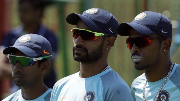 Wriddhiman Saha, with teammates Shikhar Dhawan and Hardik Pandya, watch the practice session in Centurion. (AP) Wriddhiman Saha, with teammates Shikhar Dhawan and Hardik Pandya, watch the practice session in Centurion. (AP)