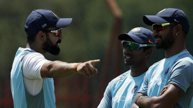 Virat Kohli chats with teammates during their training at Centurion Park in Pretoria. (AP) Virat Kohli chats with teammates during their training at Centurion Park in Pretoria. (AP)