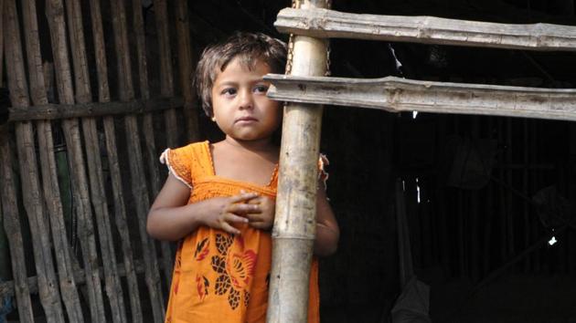 Rukshar Khatun, the last polio victim of the country, poses for a photo outside her house in the Howrah district, West Bengal.She survived the virus, but it left its mark as she limps because her left ankle still hurts when she walks. (Subhendu Ghosh / Hindustan Times)