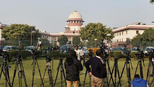 Lensmen outside the Supreme Court in New Delhi. (PTI) Lensmen outside the Supreme Court in New Delhi. (PTI)