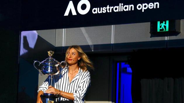 Tussia's Maria Sharapova walks into the venue with the Australian Open women's singles trophy during the official draw ceremony. (REUTERS) Tussia's Maria Sharapova walks into the venue with the Australian Open women's singles trophy during the official draw ceremony. (REUTERS)