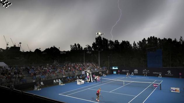 Lightning is seen in the sky above the court where Germany's Angelique Kerber plays her first-round match against Czech Republic's Lucie Safarova during the Sydney International on January 8, 2018. (AAP / Craig Golding via REUTERS) Lightning is seen in the sky above the court where Germany's Angelique Kerber plays her first-round match against Czech Republic's Lucie Safarova during the Sydney International on January 8, 2018. (AAP / Craig Golding via REUTERS)