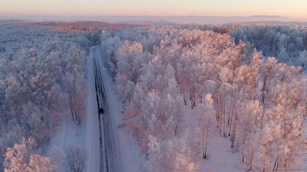 An aerial view shows a car driving along a forest road during sunset, with the air temperature at about minus 27 degrees Celsius in the Siberian Taiga outside the village of Balakhta, Russia on January 5, 2018. (Ilya Naymushin / REUTERS) An aerial view shows a car driving along a forest road during sunset, with the air temperature at about minus 27 degrees Celsius in the Siberian Taiga outside the village of Balakhta, Russia on January 5, 2018. (Ilya Naymushin / REUTERS)