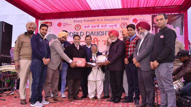 Athlete Mann Kaur being given the ‘Dhee Punjab Di’ award in Sangrur on Friday.(HT Photo)