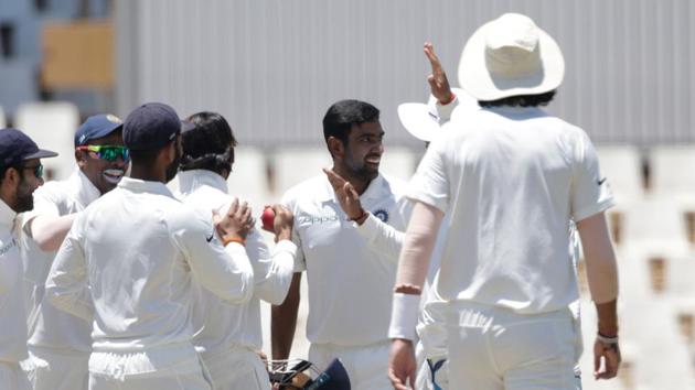 R Ashwin celebrates with teammates the dismissal of Quinton de Kock on the first day of the second Test between South Africa and India at the Supersport park Cricket Ground in Centurion. Follow full cricket score of India vs South Africa, 2nd Test, Day 1 here on Saturday.(AFP)