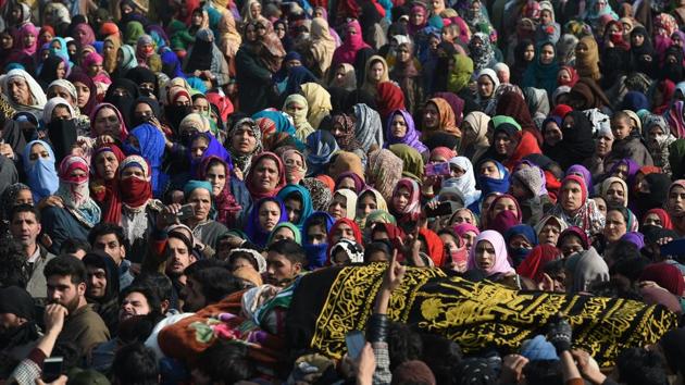 Kashmiri villagers look on at a funeral procession of the militant Farhaan Wani at Kulgam district on January 10. (Tauseef Mustafa / AFP) Kashmiri villagers look on at a funeral procession of the militant Farhaan Wani at Kulgam district on January 10. (Tauseef Mustafa / AFP)