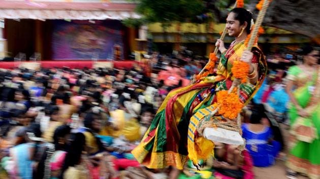 An Indian student reacts on a swing during celebrations for Pongal, the Tamil harvest festival, at a college in Chennai. (Arun Sarkar / AFP) An Indian student reacts on a swing during celebrations for Pongal, the Tamil harvest festival, at a college in Chennai. (Arun Sarkar / AFP)