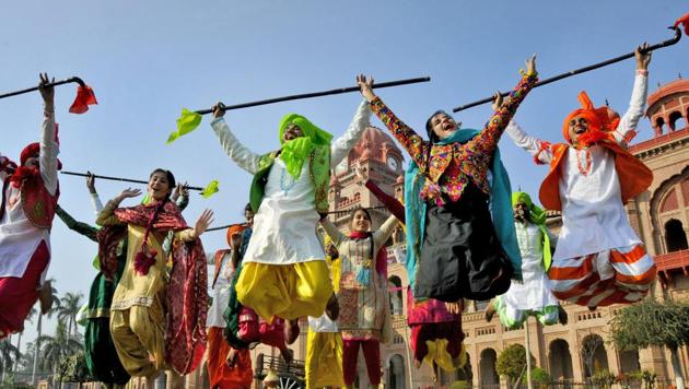 College students dance during the Lohri festival celebrations in Amritsar.The folk festival also marks the celebration of harvest. (PTI) College students dance during the Lohri festival celebrations in Amritsar.The folk festival also marks the celebration of harvest. (PTI)