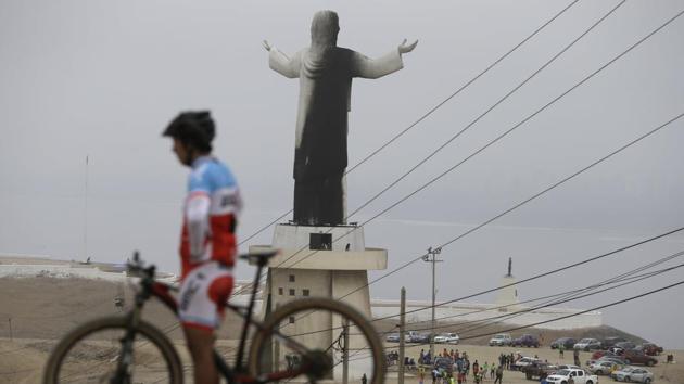 A man rests with his bicycle near the Cristo del Pacifico (Christ of the Pacific) statue in Lima, Peru, on Saturday, Jan. 13, 2018. The replica of the Christ the Redeemer Statue in Rio de Janeiro was set on fire days before Pope Francis is scheduled to arrive in the South American nation. (AP Photo) A man rests with his bicycle near the Cristo del Pacifico (Christ of the Pacific) statue in Lima, Peru, on Saturday, Jan. 13, 2018. The replica of the Christ the Redeemer Statue in Rio de Janeiro was set on fire days before Pope Francis is scheduled to arrive in the South American nation. (AP Photo)
