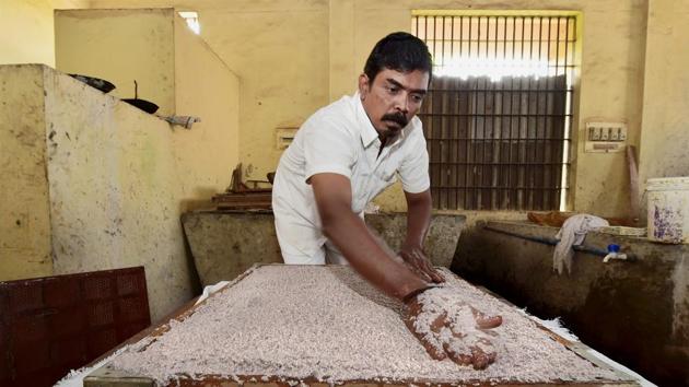 An inmate uses demonetised notes supplied by Reserve Bank of India, for making file pads at Puzhal Central Prison in Chennai. (R Senthil Kumar / PTI) An inmate uses demonetised notes supplied by Reserve Bank of India, for making file pads at Puzhal Central Prison in Chennai. (R Senthil Kumar / PTI)