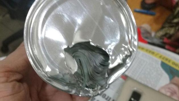 The currency was hidden in sealed tins of food products. (HT Photo) The currency was hidden in sealed tins of food products. (HT Photo)
