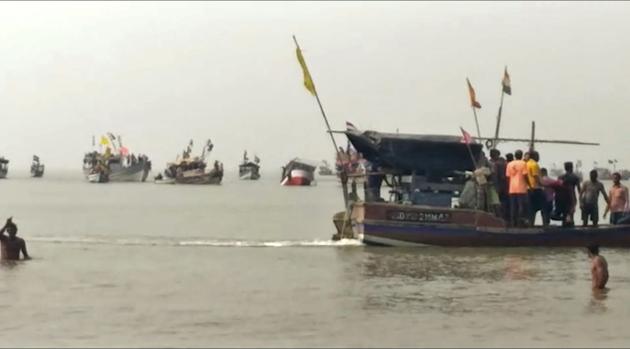 Dahanu : This screen grab from video shows rescuers looking for survivors and bodies of victims of a boat carrying schoolchildren in the Arabian Sea in Dahanu, in Maharashtra state, India, Saturday, Jan. 13, 2018. Indian police say a ferry boat carrying schoolchildren sank in the Arabian Sea off the country's western coast, killing two students and leaving six missing.AP/ PTI(AP1_13_2018_000145B) (AP) Dahanu : This screen grab from video shows rescuers looking for survivors and bodies of victims of a boat carrying schoolchildren in the Arabian Sea in Dahanu, in Maharashtra state, India, Saturday, Jan. 13, 2018. Indian police say a ferry boat carrying schoolchildren sank in the Arabian Sea off the country's western coast, killing two students and leaving six missing.AP/ PTI(AP1_13_2018_000145B) (AP)
