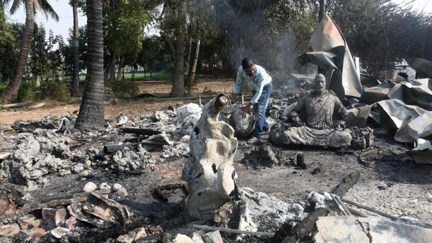 Eldine Fernandes, an artist, at his sculpture workshop that was torched following the violence at Bhima Koregaon on Tuesday. (Pratham Gokhale/HT Photo) 