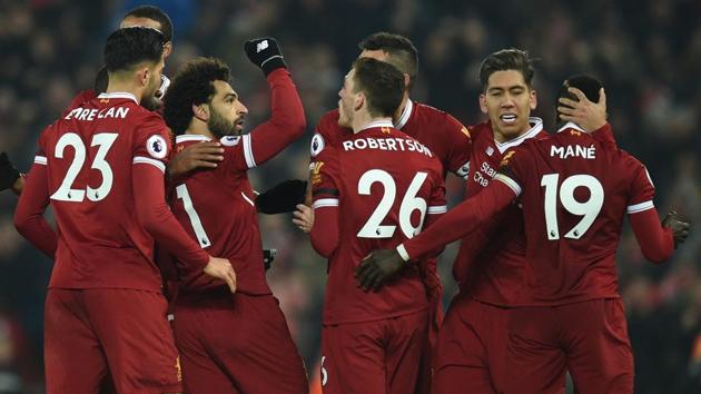 Liverpool's Egyptian midfielder Mohamed Salah (2L) celebrates scoring their fourth goal during the 4-3 win over Manchester City at Anfield. (AFP) Liverpool's Egyptian midfielder Mohamed Salah (2L) celebrates scoring their fourth goal during the 4-3 win over Manchester City at Anfield. (AFP)