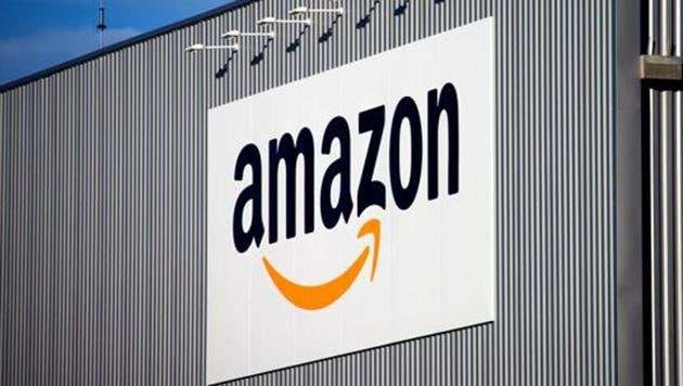 FILE - This Sept. 19 2013 file photo, the Amazon logo is seen on the new logistics center of online merchant Amazon in Lauwin-Planque, northern France (AP) FILE - This Sept. 19 2013 file photo, the Amazon logo is seen on the new logistics center of online merchant Amazon in Lauwin-Planque, northern France (AP)