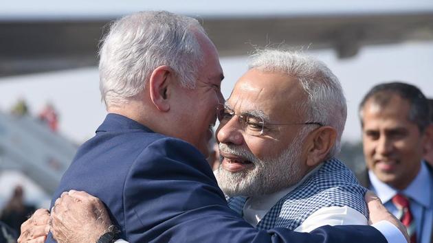 In this photograph released by the Press Information Bureau, Prime Minister Narendra Modi welcomes the Prime Minister of Israel, Benjamin Netanyahu on his arrival at Palam.(AFP Photo)